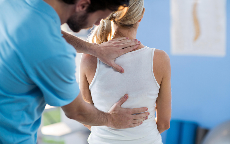 Specialist Sports & Spinal Physiotherapy Nedlands Woman Back being manipulated